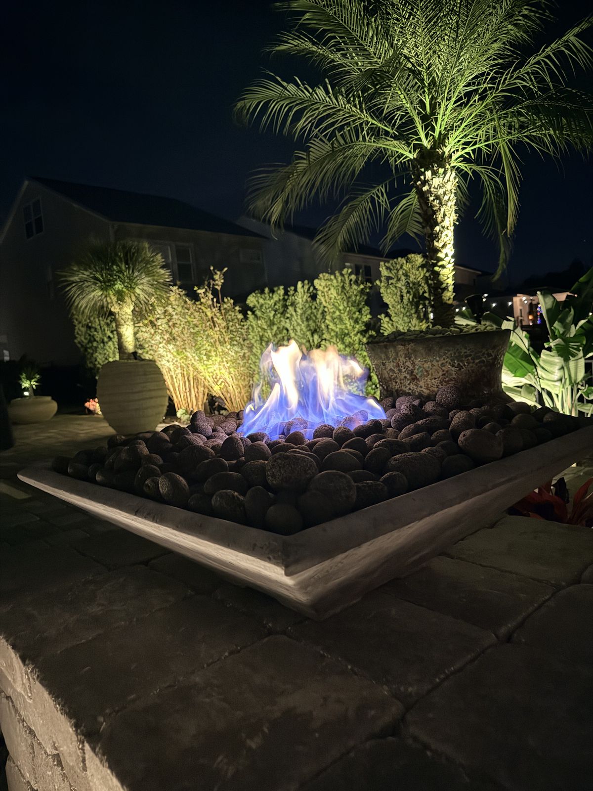 Custom paver firepit with fire bowl and landscape lighting, St. Augustine FL