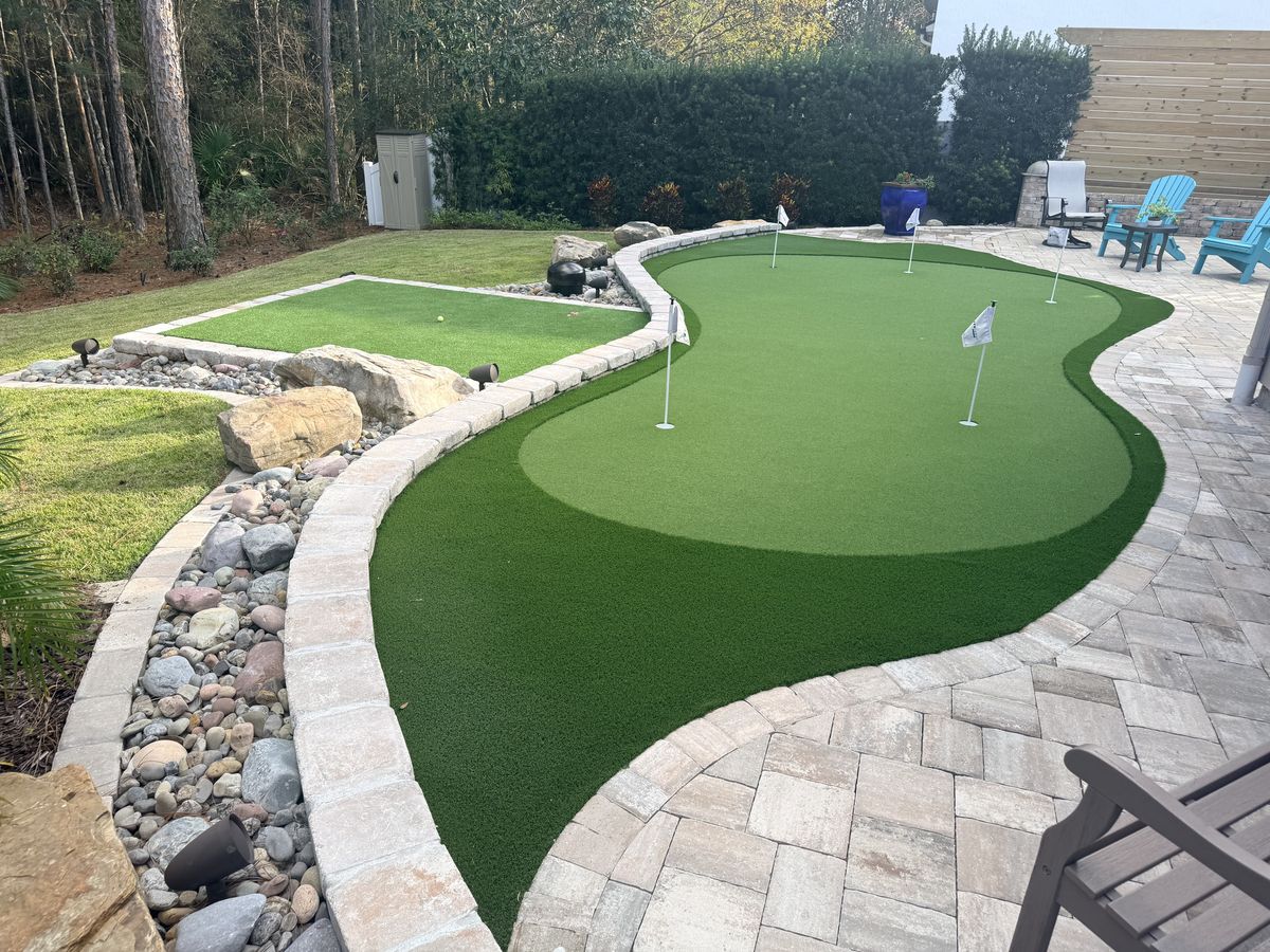 Backyard putting green with paver border, Jacksonville FL